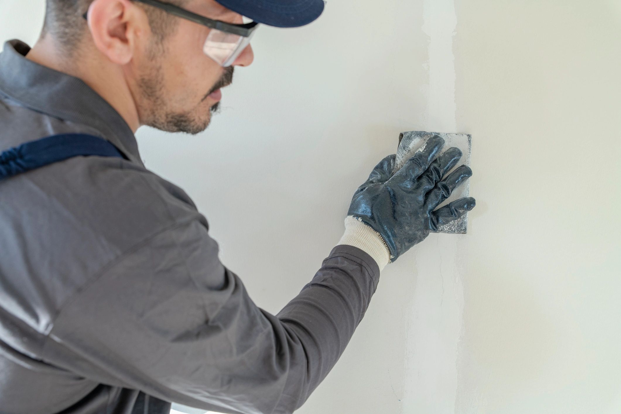 Close-up of drywall repair sanding