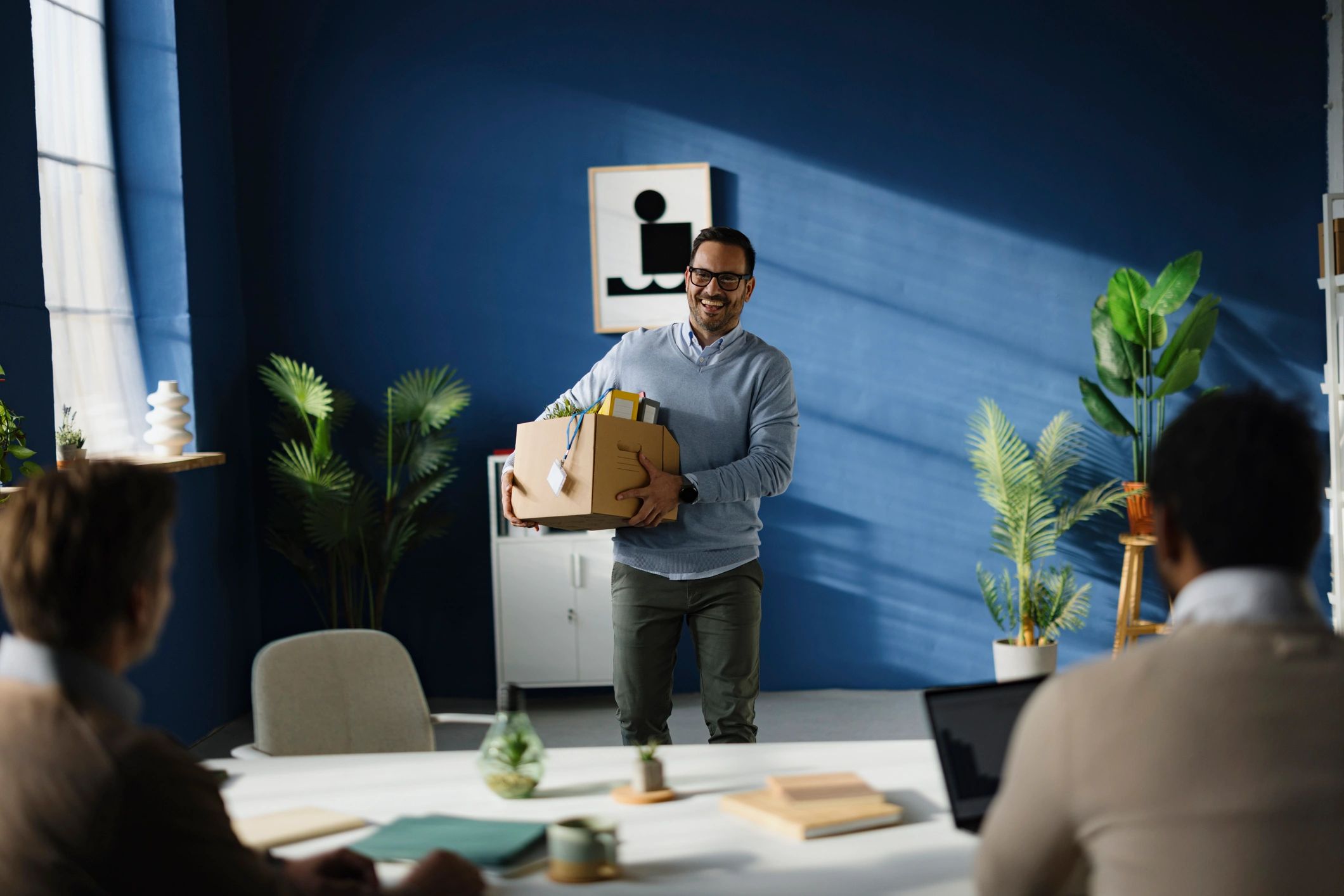 Team moving belongings into a new office