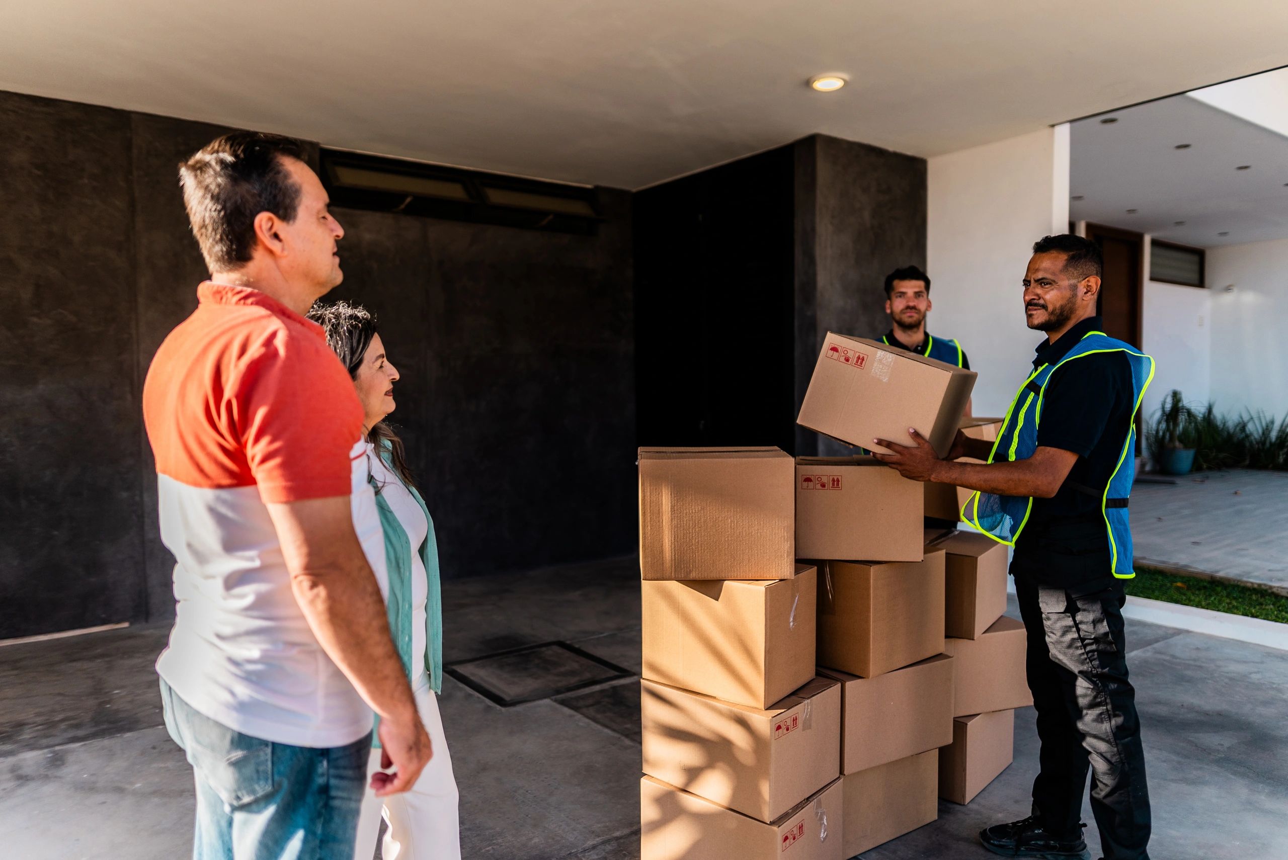 MyGuy moving crew unloading a truck and speaking with a customer