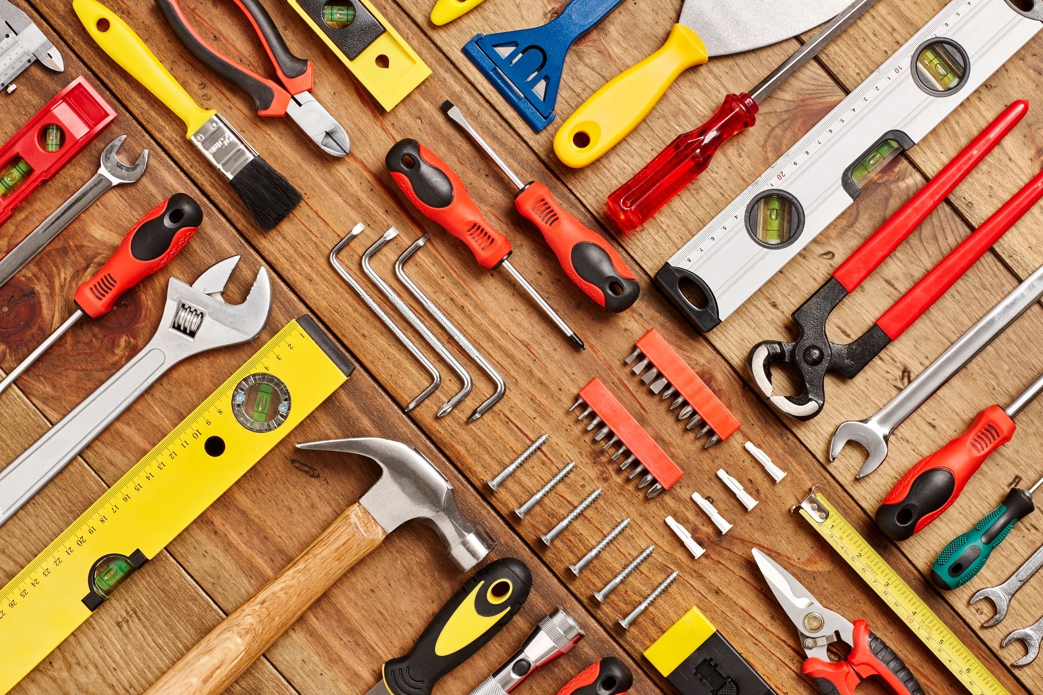 Hand tools arranged on a workbench